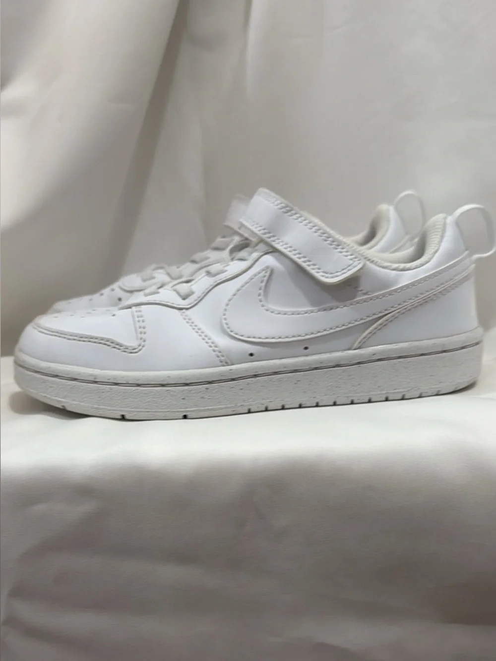 Boys white Nike sneakers